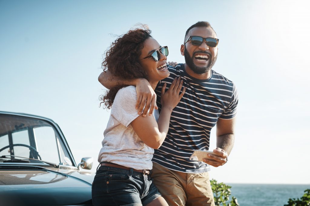 Young couple enjoying a summer’s road trip together